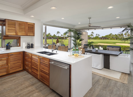 Luxury rental of kitchen and living room opened to outside and golf course views, provided by Big Island Realtor Diana Mahaney